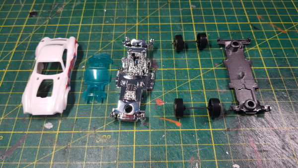 a matchbox car, deconstructed and ready to be painted and customised for Gaslands