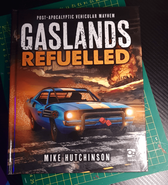 A photo of the rulebook for the tabletop game Gaslands