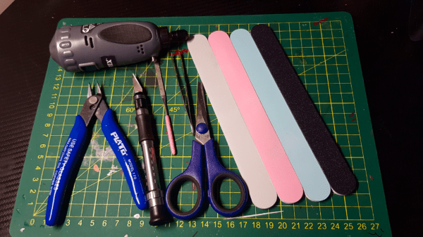 A photo of files, scissors, model nippers, craft knives and a rotary tool - for making Gaslands Cars